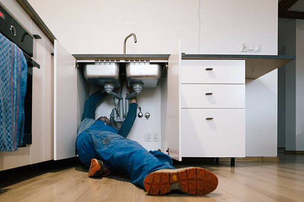 Professional Emergency Plumber technician working in Brighton, MA